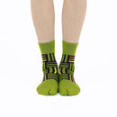 Person wearing long green Tabi Socks " Sankuzushi ", front view