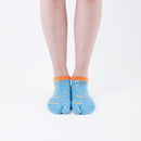 Person wearing short light blue Tabi Socks " Shirasu ", front view