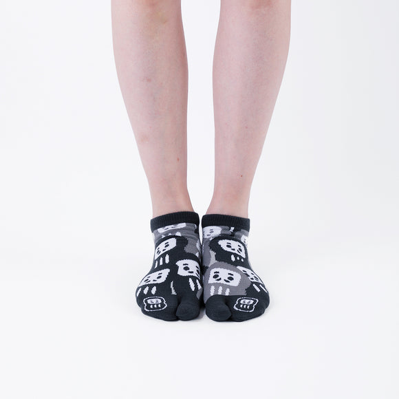 Person wearing short black Tabi Socks " Daruma ", front view