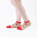 Person wearing short red Tabi Socks " Nara-e ", right side view
