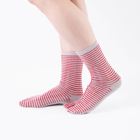 Person wearing long red Tabi Socks " Hyoshigi ", right side view