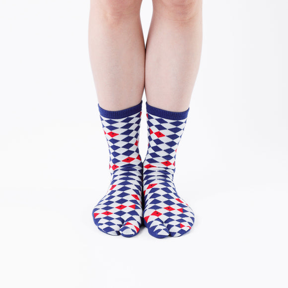 Person wearing long blue Tabi Socks " Kingyo 2 ", front view