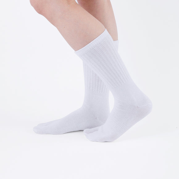 Person wearing  white Tabi Socks "NOBI NOBI", right side view